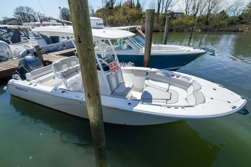 The Image of 2024 Sea Fox 248 Commander boat docked, featuring spacious seating and modern design. - 0