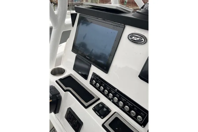 Slide: The Image of 2024 Sea Fox 248 Commander dashboard with touchscreen and control panel. - 16