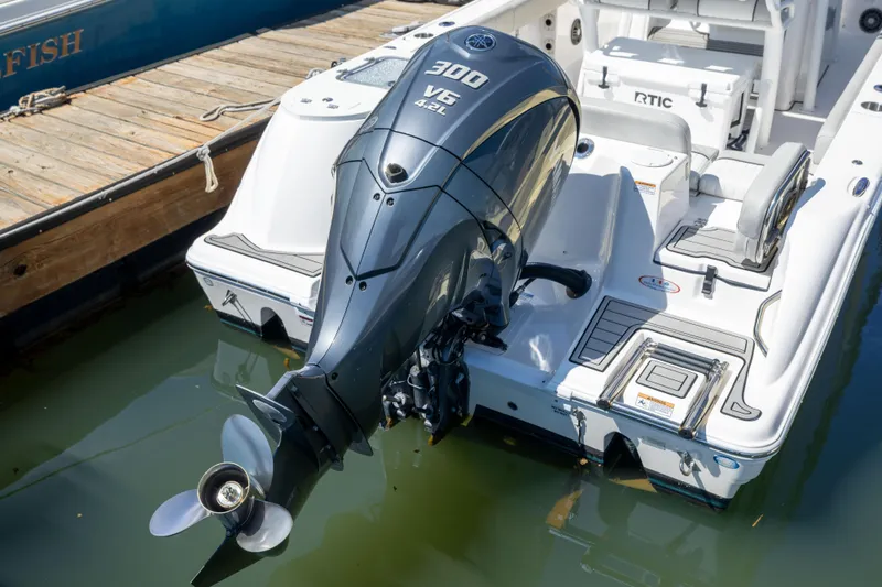 Slide: The Image of 2024 Sea Fox 248 Commander with powerful 300 V6 outboard engine docked at marina. - 23