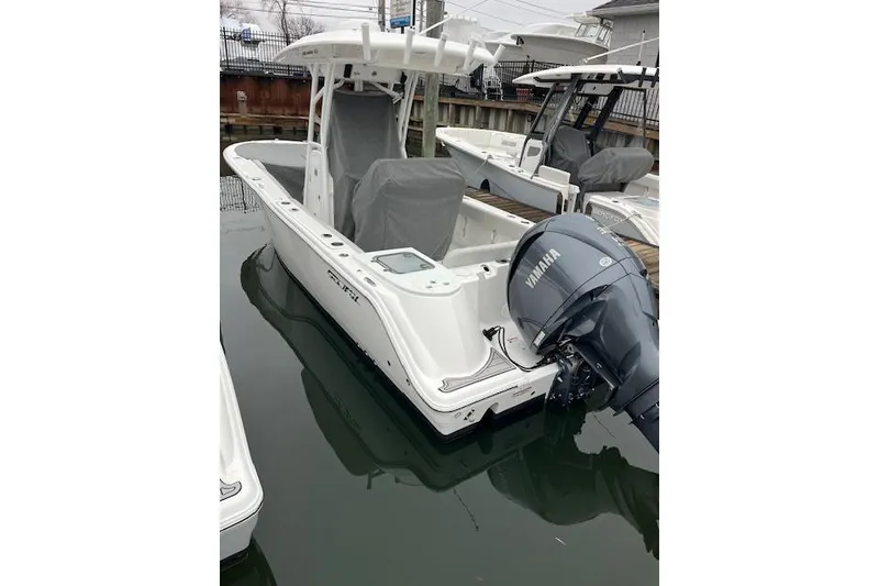 Slide: The Image of 2024 Sea Fox 248 Commander boat with Yamaha engine docked in marina. - 3
