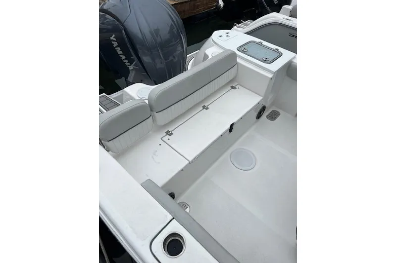 Slide: The Image of 2024 Sea Fox 248 Commander boat interior with seating and Yamaha engine. - 4
