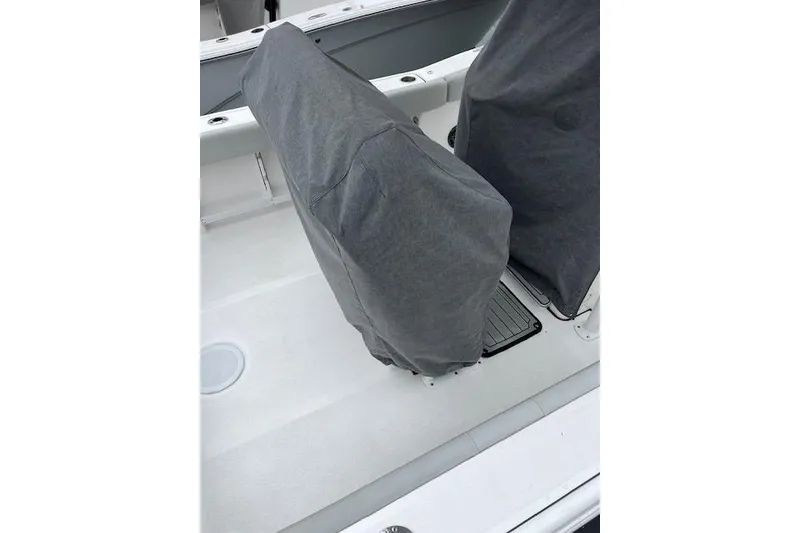 Slide: The Image of 2024 Sea Fox 248 Commander boat seats covered with protective gray fabric. - 5