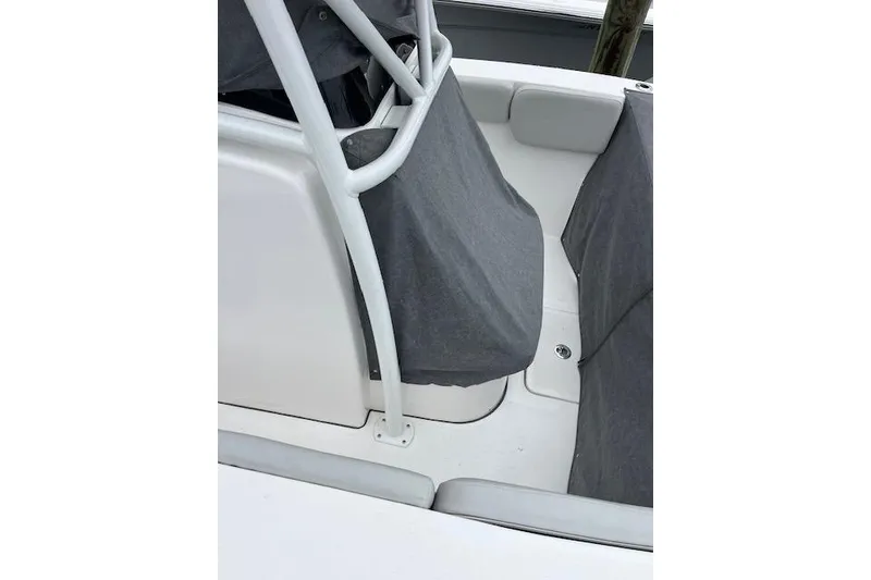 Slide: The Image of 2024 Sea Fox 248 Commander boat interior with gray covers and seating area. - 7