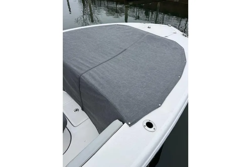 Slide: The Image of 2024 Sea Fox 248 Commander boat with a gray cover on the deck. - 8