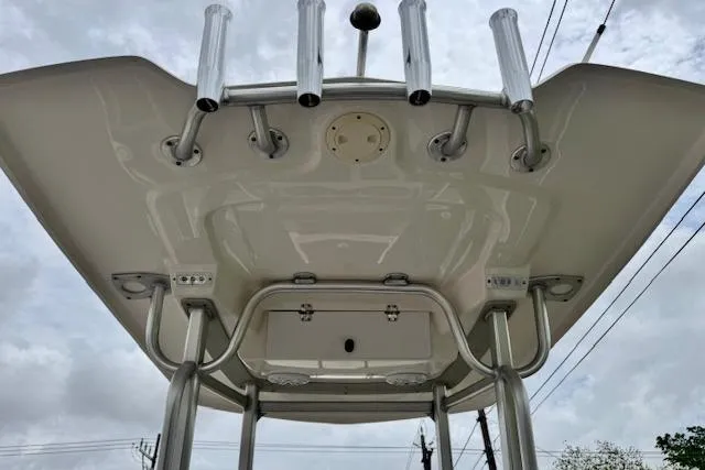 Slide: The Image of 2015 Robalo 226 Cayman boat top view with rod holders and canopy. - 11