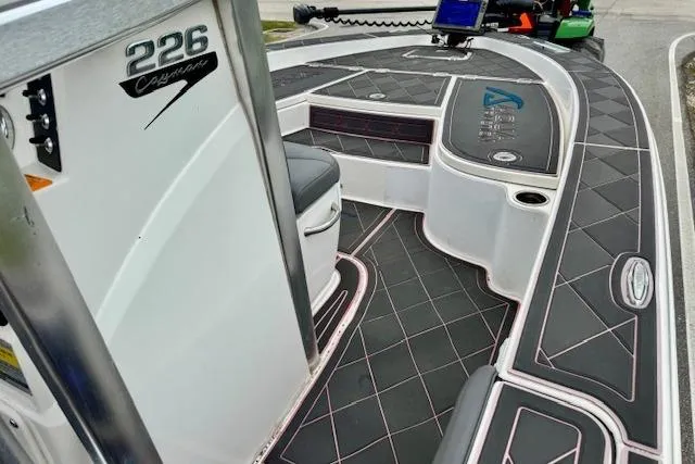 Slide: The Image of 2015 Robalo 226 Cayman boat interior with sleek black and white design. - 14