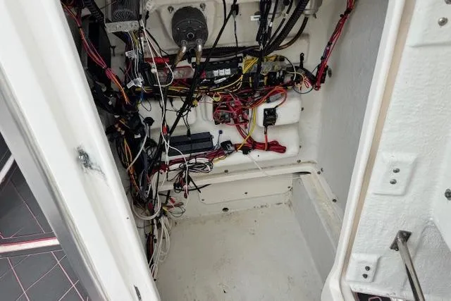 Slide: The Image of Interior wiring of a 2015 Robalo 226 Cayman boat, showcasing complex electrical setup. - 16