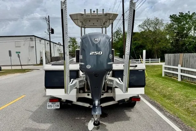 Slide: The Image of 2015 Robalo 226 Cayman boat with Yamaha 250 engine on a road. - 3