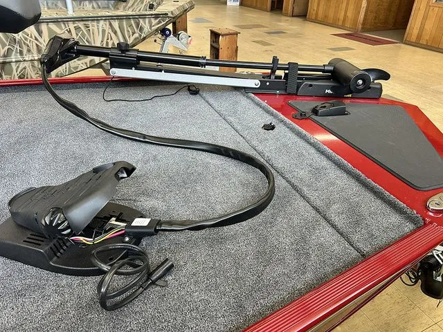 Slide: The Image of 2026 Tracker Bass Tracker Classic XL boat deck with fishing equipment. - 12