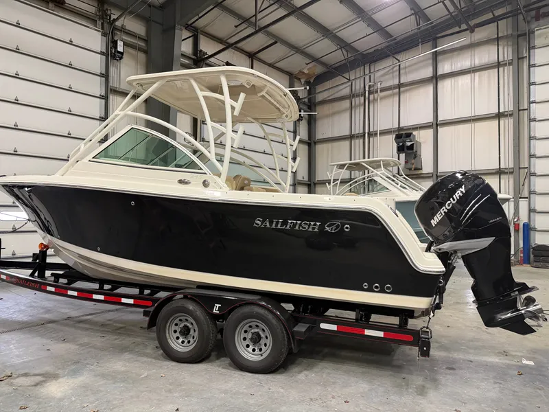 The Image of 2018 Sailfish 245 DC boat in warehouse on trailer. - 0