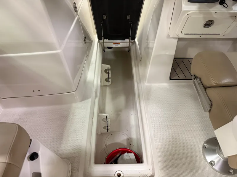 Slide: The Image of Interior of 2018 Sailfish 245 DC with storage and seating. - 14