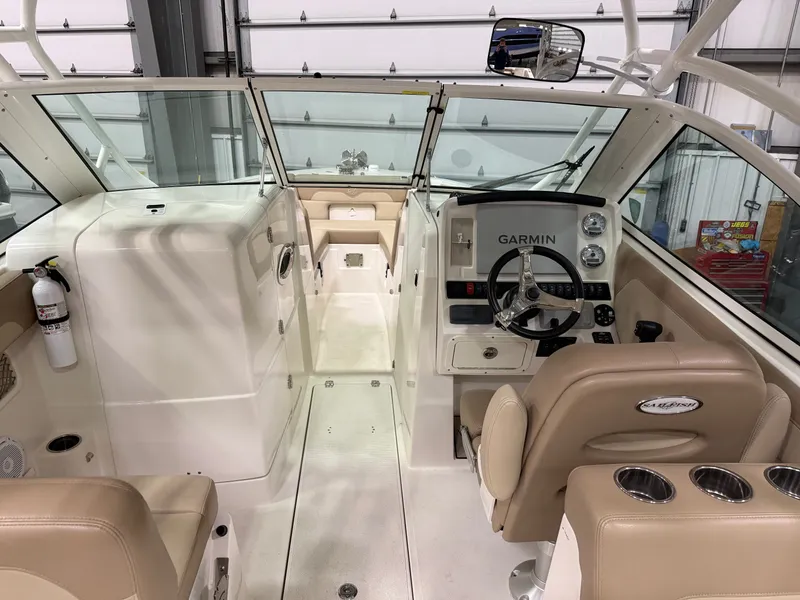 Slide: The Image of Interior of a 2018 Sailfish 245 DC boat with Garmin controls. - 5