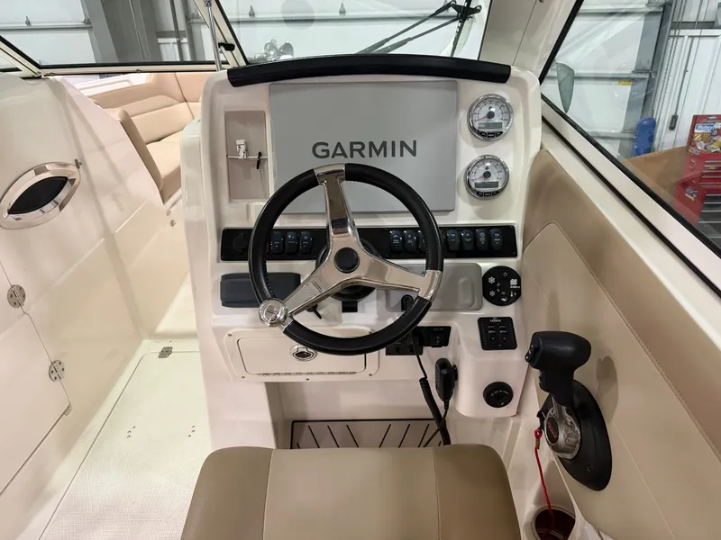 Slide: The Image of 2018 Sailfish 245 DC helm with Garmin navigation system. - 6