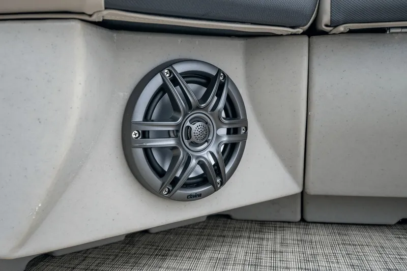 Slide: The Image of Close-up of a speaker on a boat, integrated into a cushioned seating area. - 13