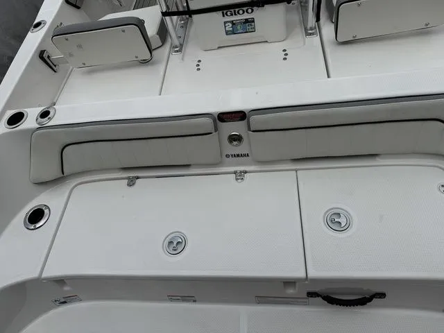 Slide: The Image of Yamaha Boats 195 FSH Sport 2025, white deck and seating area. - 7