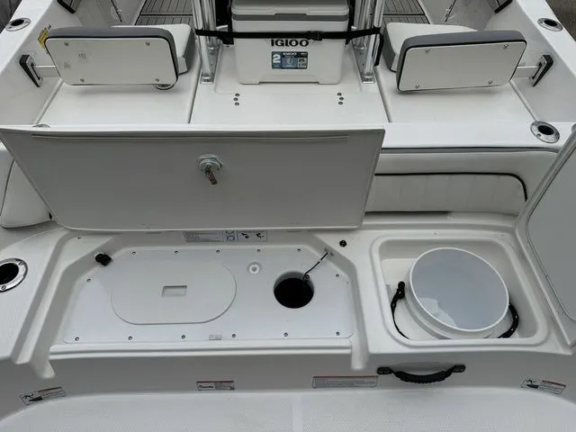 Slide: The Image of Yamaha Boats 195 FSH Sport 2025, interior view with storage and cooler. - 8
