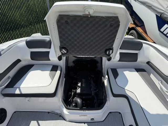 Slide: The Image of Yamaha Boats SX195 2025 engine compartment with open covers. - 12