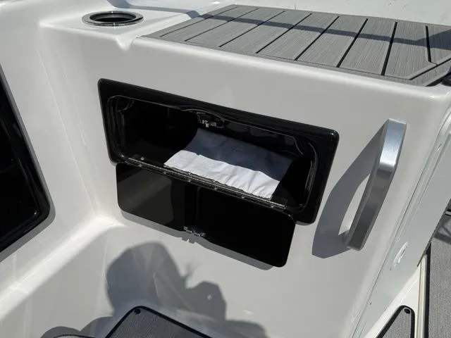 Slide: The Image of Storage compartment in 2025 Yamaha Boats SX195 boat. - 18
