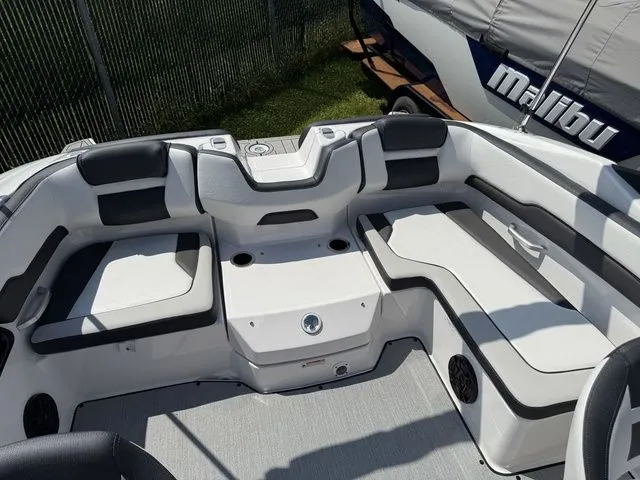 Slide: The Image of Interior of a 2025 Yamaha SX195 boat with gray and white seating. - 7