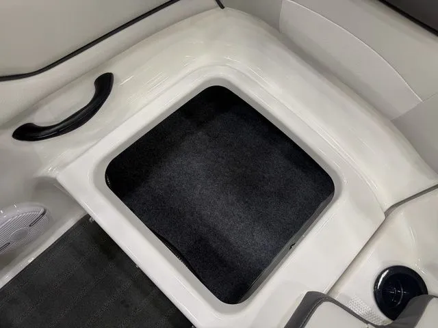 Slide: The Image of Interior of Yamaha SX190 boat, 2026 model, featuring storage compartment. - 10