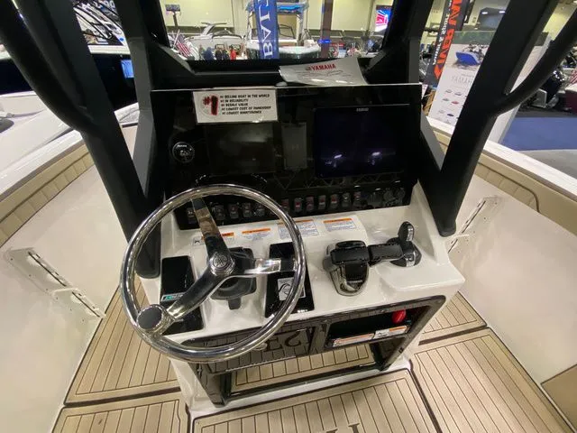 Slide: The Image of Yamaha Boats 2024 255 FSH Sport H helm with steering wheel and controls. - 12