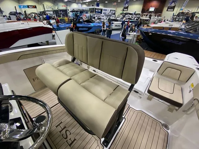 Slide: The Image of Interior view of 2024 Yamaha Boats 255 FSH Sport H with beige seating. - 14