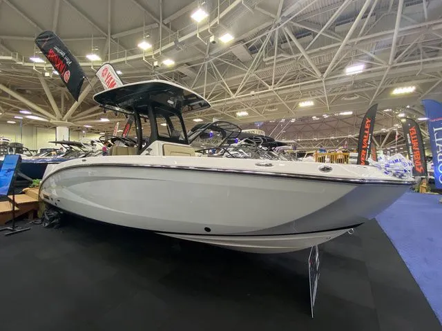 Slide: The Image of 2024 Yamaha Boats 255 FSH Sport H at a boat show. - 2