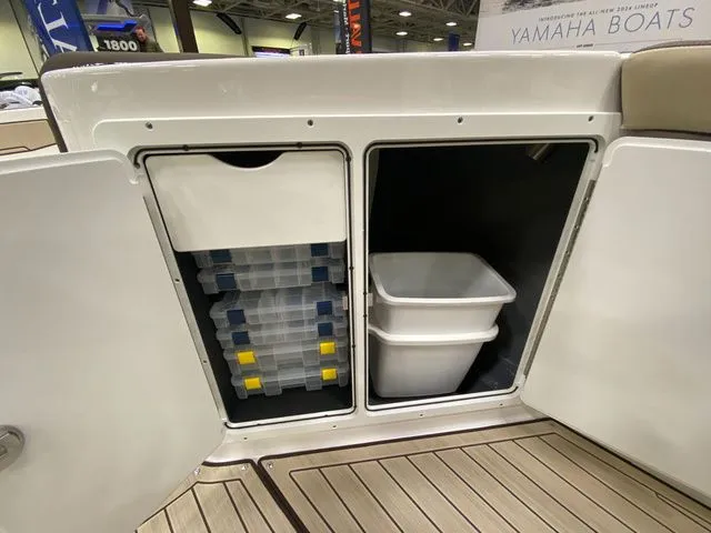 Slide: The Image of Storage area in 2024 Yamaha 255 FSH Sport H boat with containers. - 20