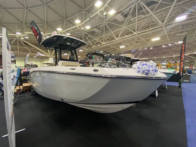 Slide: The Image of 2024 Yamaha Boats 255 FSH Sport H displayed at a boat show. - 3