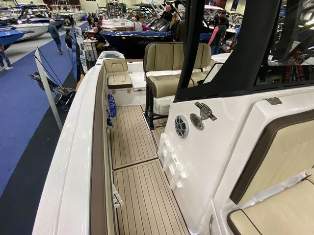 Slide: The Image of Interior view of Yamaha Boats 255 FSH Sport H 2024 at a boat show. - 32