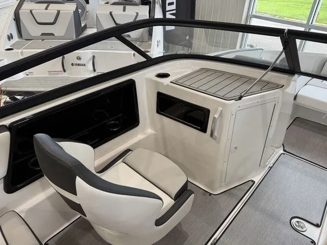 Slide: The Image of Interior of 2025 Yamaha Boats SX195 with seat and helm console. - 19