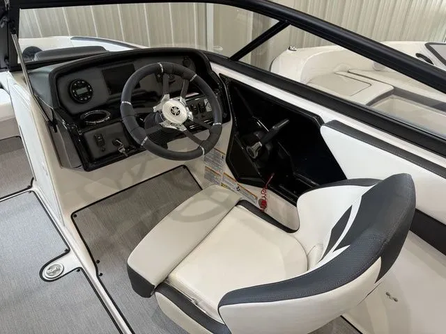Slide: The Image of Interior of 2025 Yamaha Boats SX195 with steering console and seat. - 22