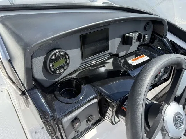 Slide: The Image of Dashboard of a 2025 Yamaha Boats AR190 with steering wheel and controls. - 17