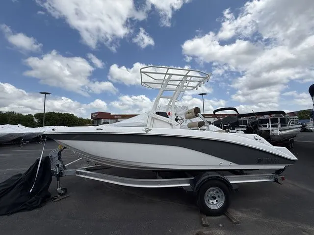 The Image of 2025 Yamaha Boats 195 FSH Sport on trailer under cloudy sky. - 1