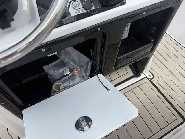 Slide: The Image of Yamaha 195 FSH Sport 2025 helm console with storage compartment. - 12