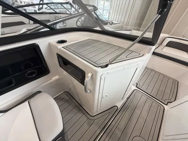 Slide: The Image of Interior of 2025 Yamaha Boats 195S with sleek wood accents. - 14