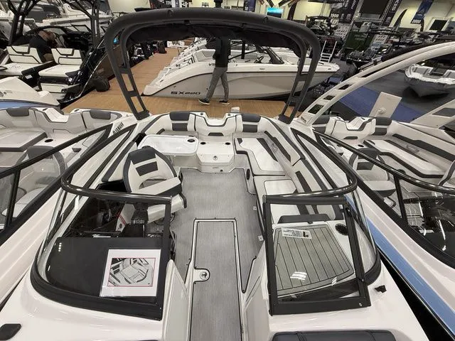 Slide: The Image of Interior view of 2025 Yamaha Boats AR195 at a boat show. - 16