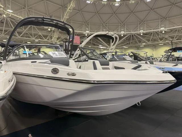 Slide: The Image of 2025 Yamaha AR195 boat displayed in an exhibition hall. - 2