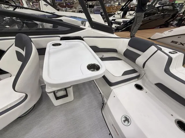 Slide: The Image of Interior of 2025 Yamaha AR195 boat with table and seating area. - 6