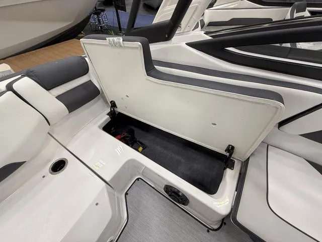 Slide: The Image of Interior of 2025 Yamaha AR195 boat with open storage compartment. - 8