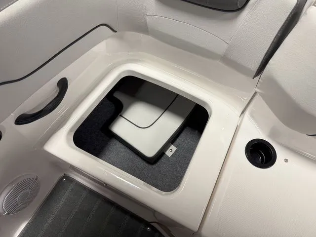 Slide: The Image of Interior of 2024 Yamaha SX190 boat with storage compartment. - 12
