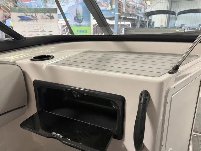 Slide: The Image of Interior view of 2024 Yamaha Boats SX190 with storage compartment. - 18