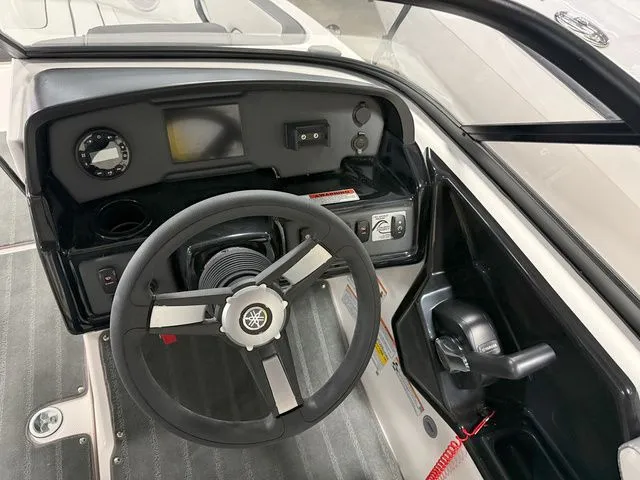 Slide: The Image of Interior view of 2024 Yamaha Boats SX190 cockpit with steering wheel. - 21