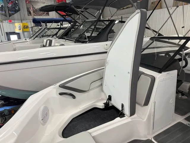 Slide: The Image of 2024 Yamaha SX190 boat with open storage compartment interior. - 27
