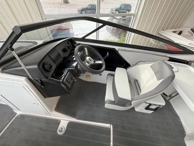 Slide: The Image of Interior of 2025 Yamaha Boats AR190 with steering console and seat. - 11