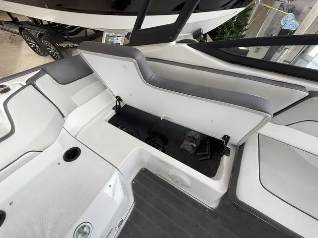 Slide: The Image of Interior of Yamaha AR190 boat, 2025 model, with open seat storage. - 8