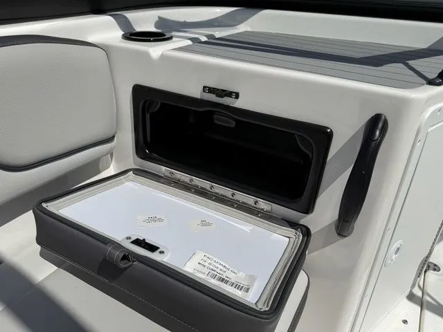 Slide: The Image of 2025 Yamaha AR190 interior with storage compartment and cup holder. - 17