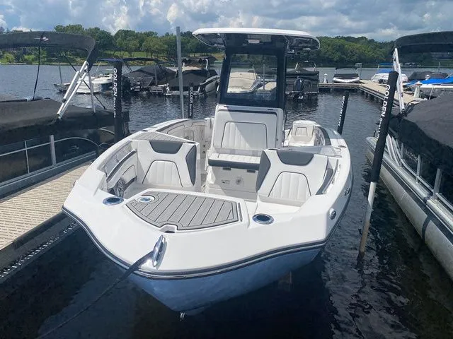Slide: The Image of 2024 Yamaha Boats 255 FSH Sport H docked, sleek design. - 2