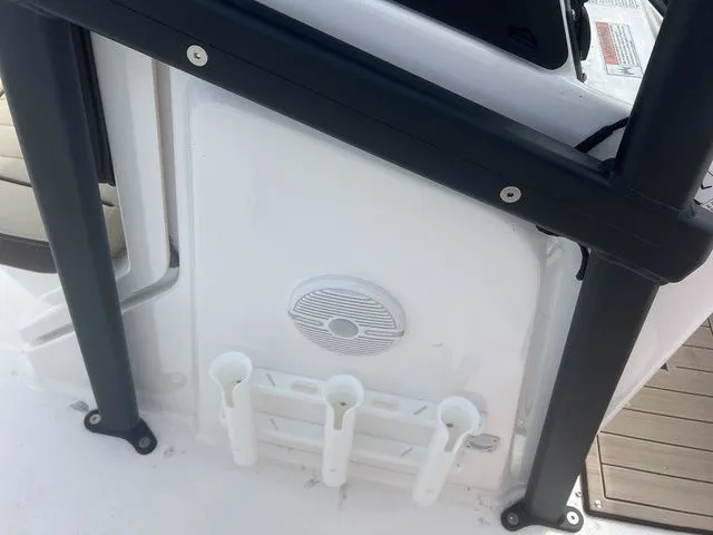 Slide: The Image of Yamaha 190 FSH Sport 2024 boat with rod holders and speaker. - 16