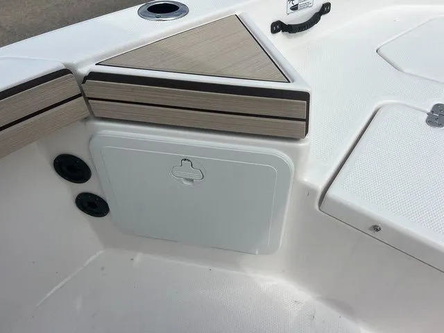 Slide: The Image of Yamaha Boats 2024 190 FSH Sport, detail of storage compartment and seating area. - 18